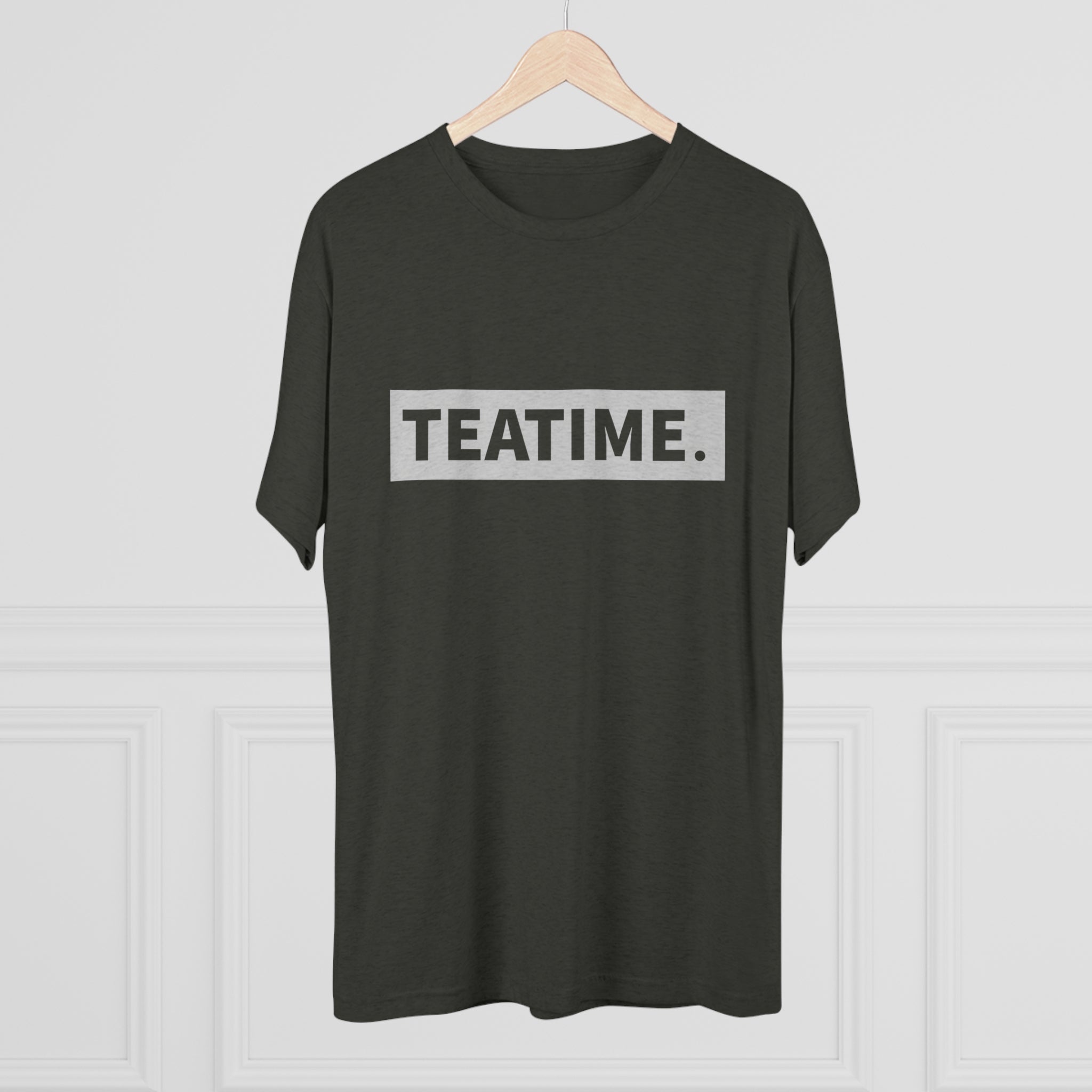 Dark green graphic tee featuring the word "TEATIME." in bold, silver lettering on a rectangular background.