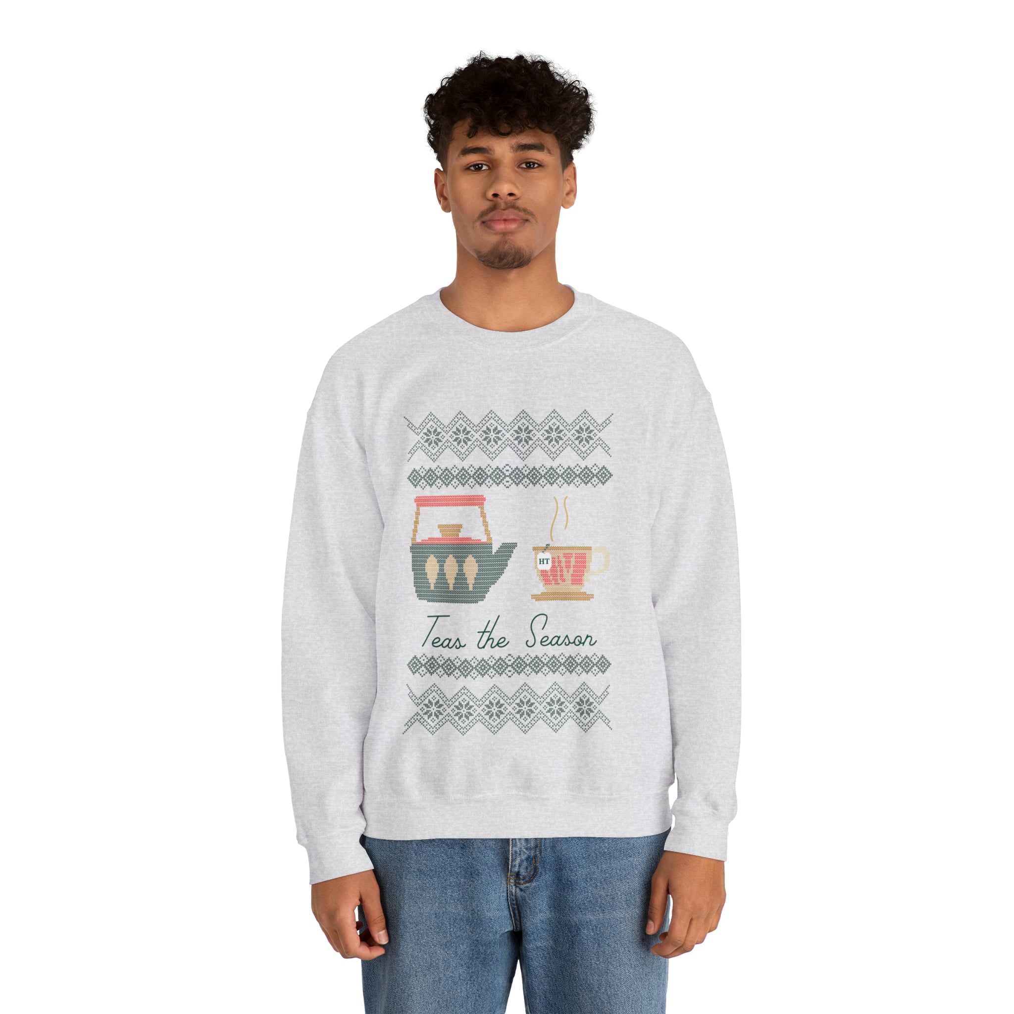 Gray holiday sweater featuring "Teas The Season" graphic with tea-themed designs and festive patterns.