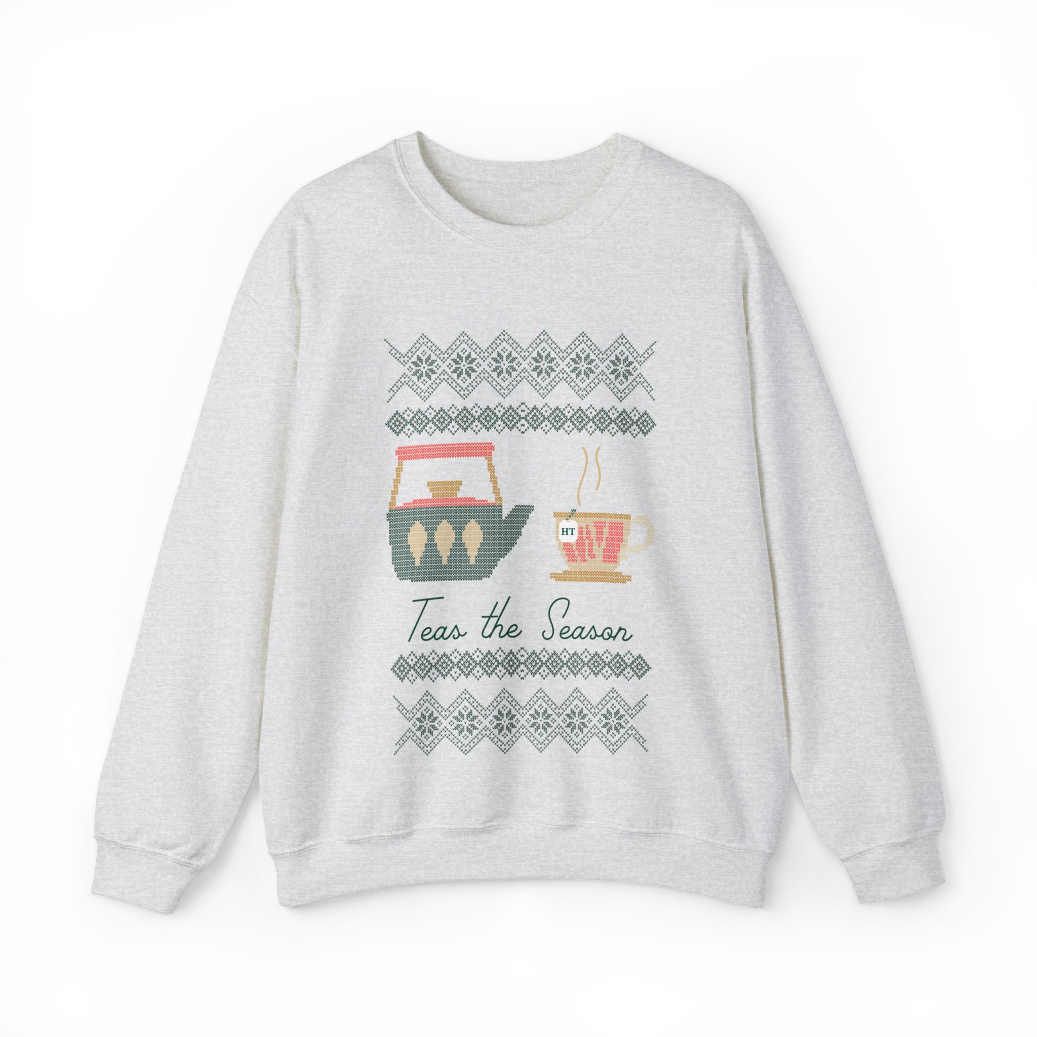 Light gray holiday sweater featuring a festive design with a teapot and cup, text reads "Teas the Season.
