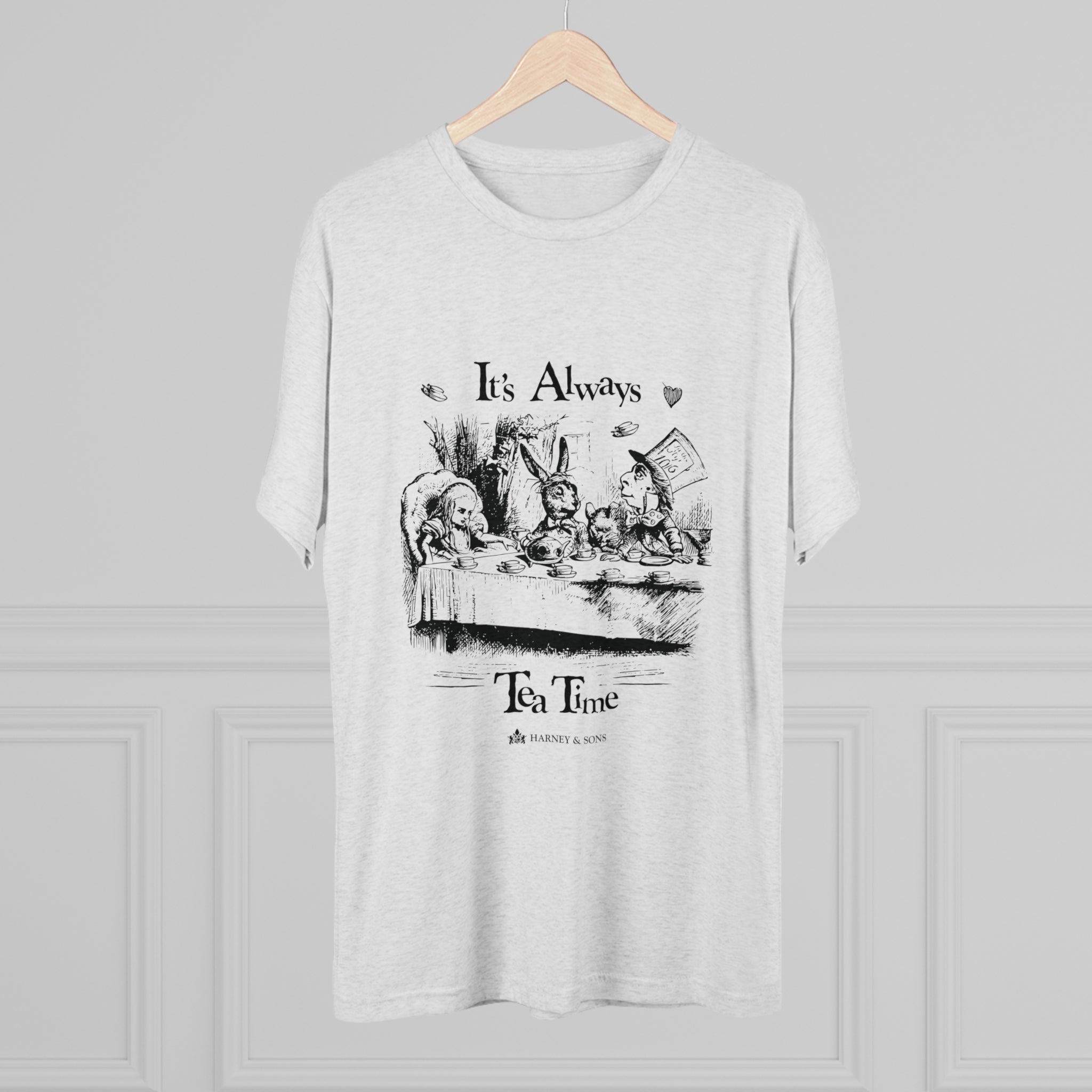 Light gray graphic tee featuring "It's Always Tea Time" text and an illustration of a whimsical tea party.