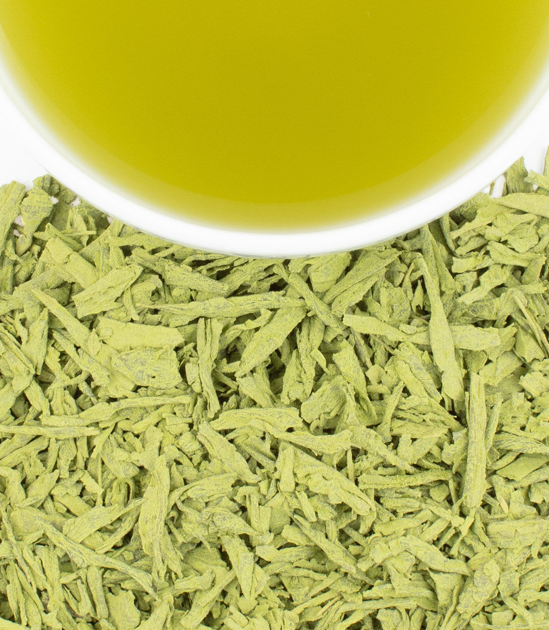 Earl Grey matcha powder with a cup of vibrant green tea above, showcasing its rich color and texture.