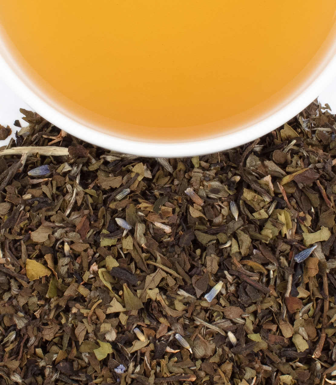 Tin of 20 sachets of Provence tea, with a cup of brewed tea and loose tea leaves displayed.