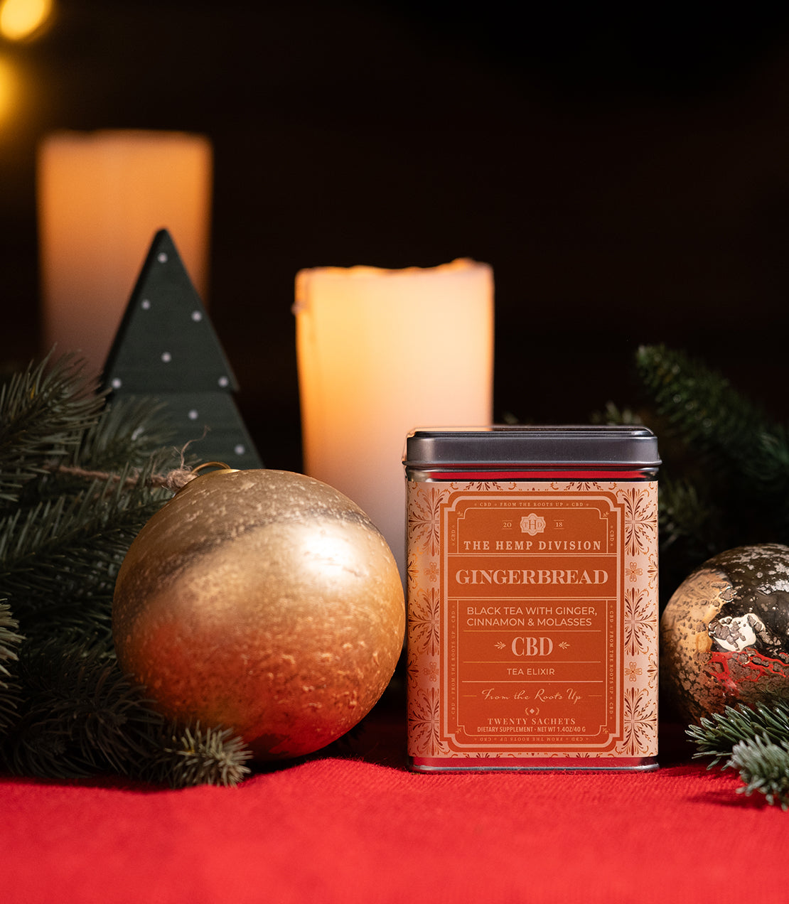 Gingerbread hemp tea tin with 20 sachets, featuring black tea blended with ginger, cinnamon, and molasses.