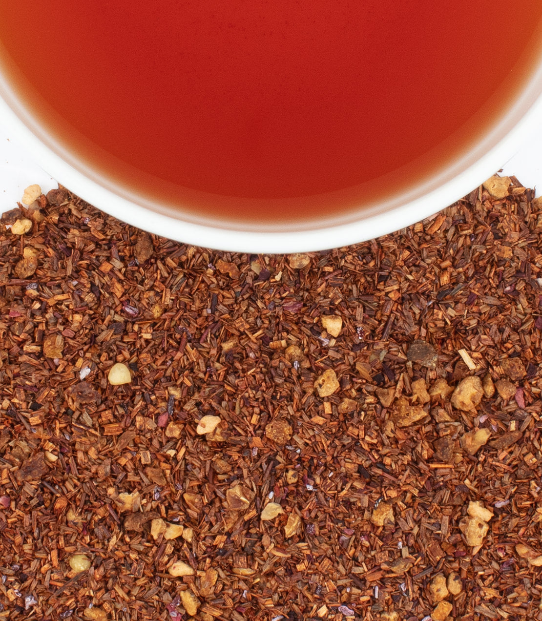 Tin of 30 Vanilla Strawberry Hibiscus tea sachets with brewed tea and loose tea blend displayed.