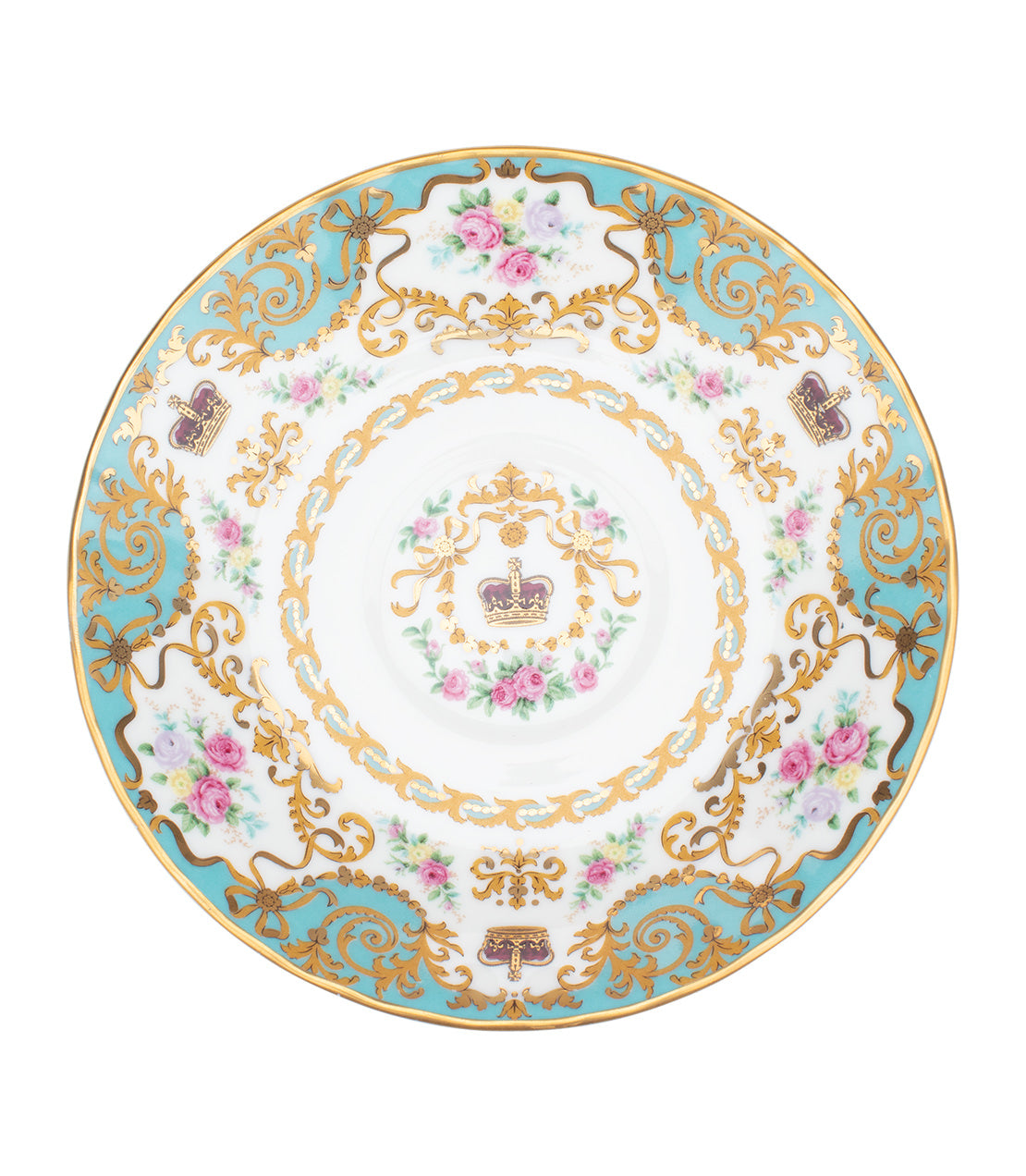 Elegant historic teacup and saucer featuring floral designs and gold accents, perfect for royal tea settings.