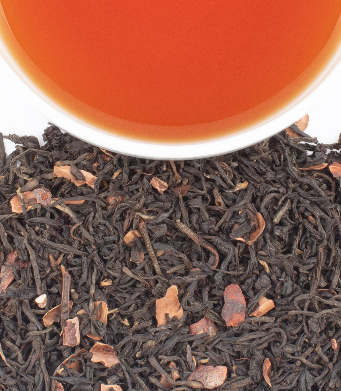Harney & Sons Fine Teas- Colombian Cocoa Kisses- Cup with tea and black tea leaves and cocoa pieces