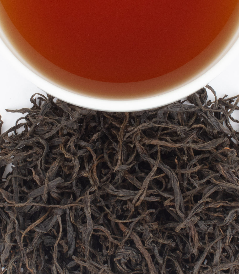 Harney & Sons Fine Teas- Hainan Black- Cup and leaves from above