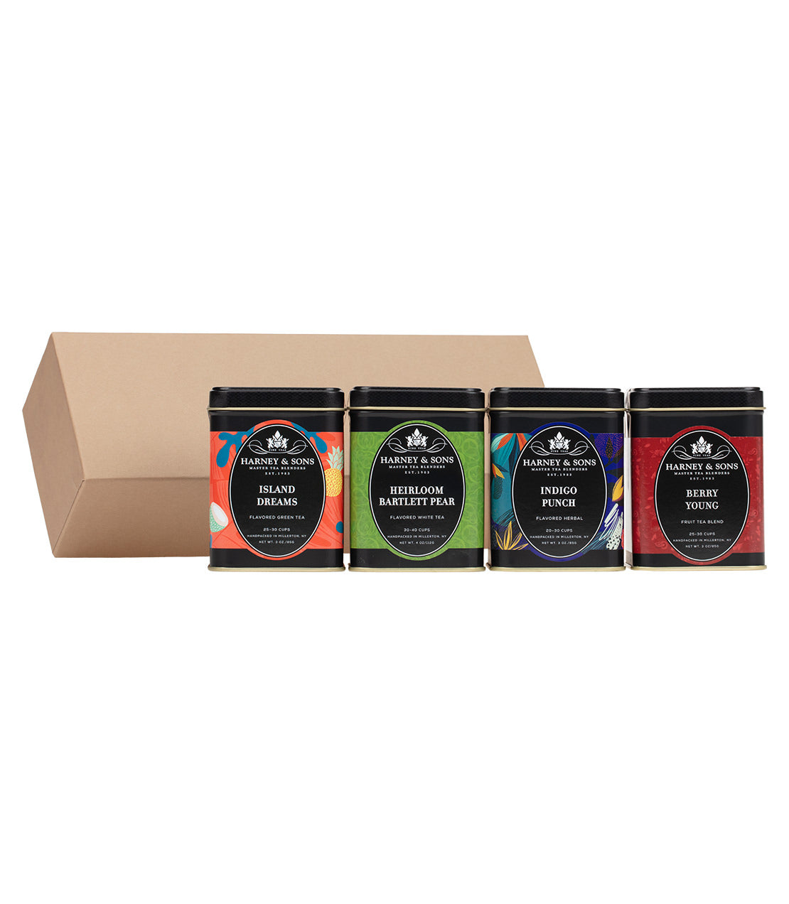 "Fruit Medley Sampler Set featuring four tea tins: Island Dreams, Heirloom Bartlett Pear, Indigo Punch, and Berry Young.