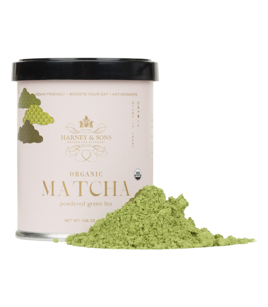 Harney & Sons Fine Teas- 30 gram tin of Organic Matcha Powder with vibrant green matcha powder piled in front- Tin is light pink with gold and green accents