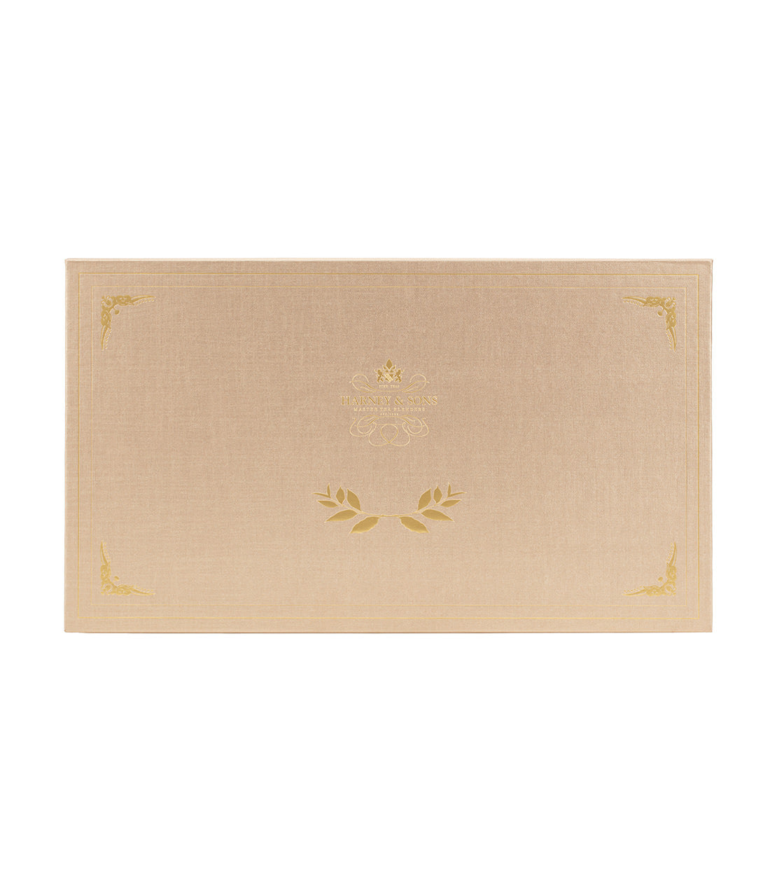 Elegant tea chest showcasing eight assorted teas, beautifully designed with gold accents on a textured beige background.