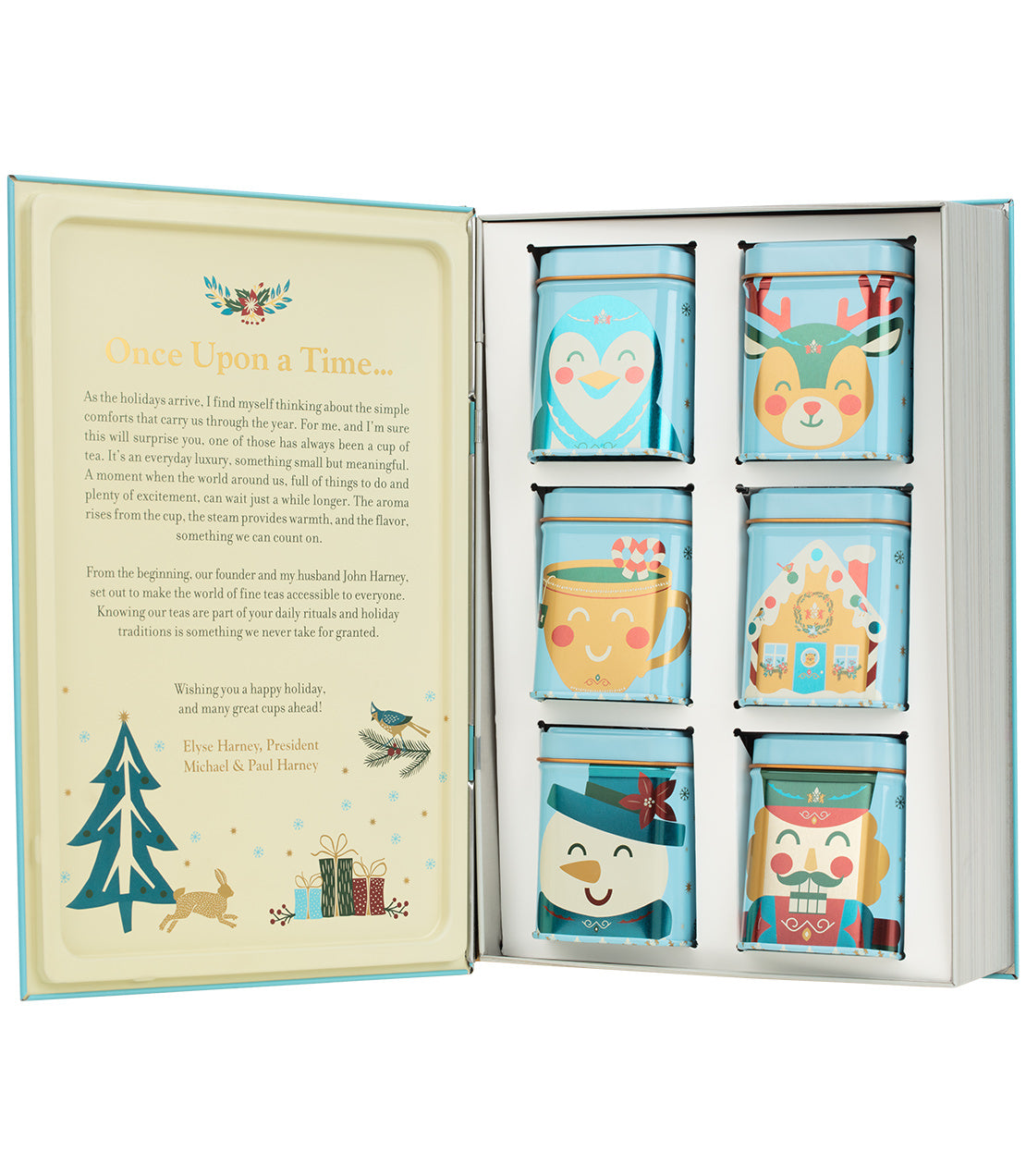 A festive holiday tea set in a gift box, featuring six illustrated tin containers with cheerful seasonal characters like a penguin, reindeer, mug, gingerbread house, snowman, and nutcracker.