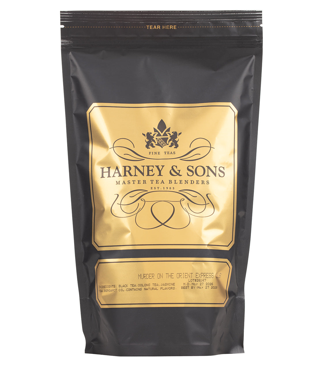 A black pouch of Harney & Sons tea labeled "Murder on the Orient Express" with gold foil labeling and a tear-seal at the top.