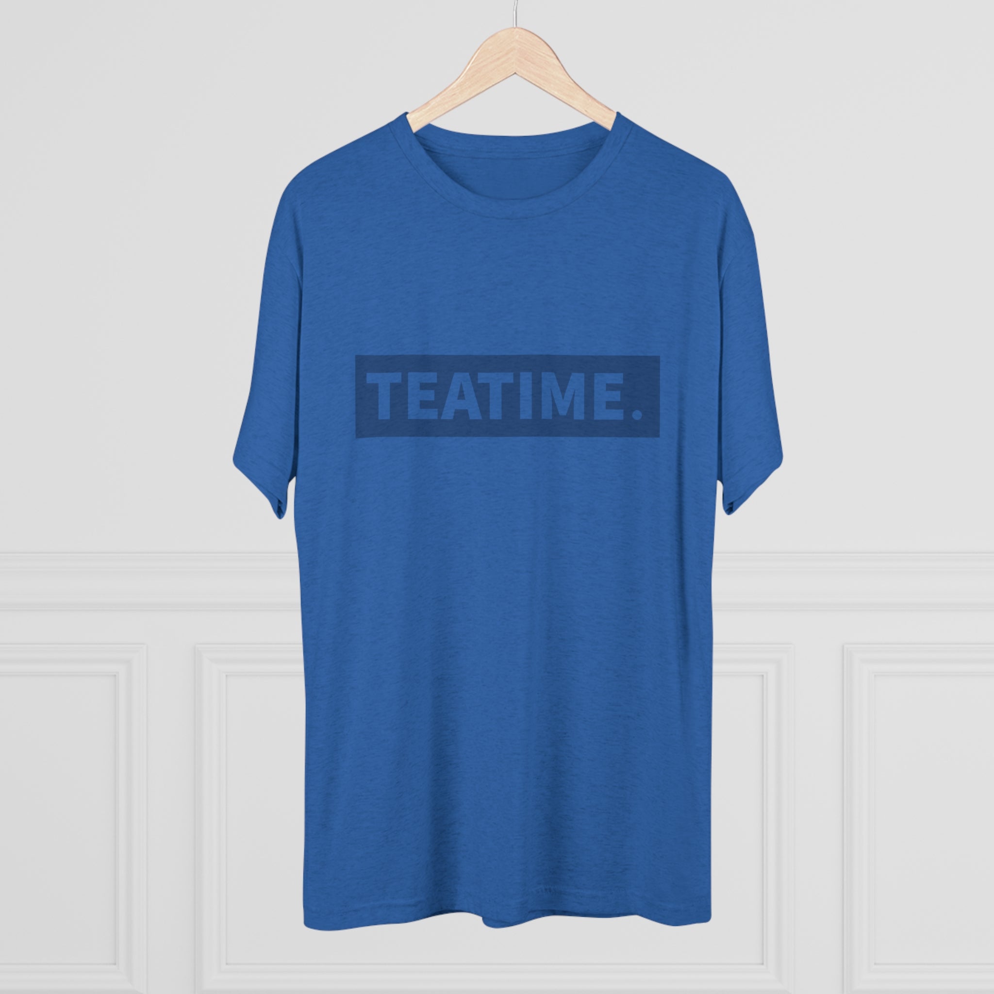 Blue graphic tee featuring the word "TEATIME." prominently displayed in a bold, modern font.