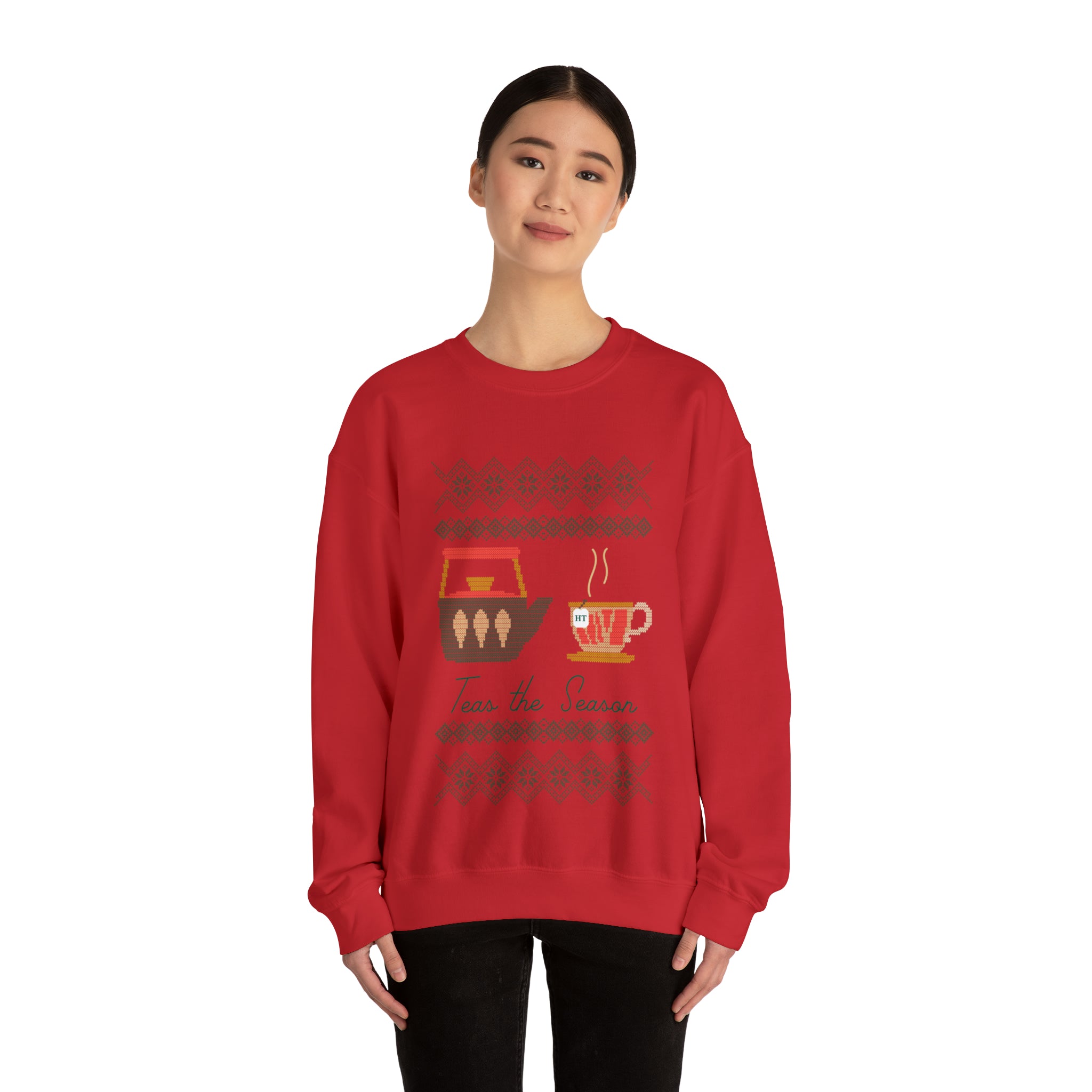 Red holiday sweater featuring a festive design with a tea cup and the phrase "Teas The Season." Perfect for winter.