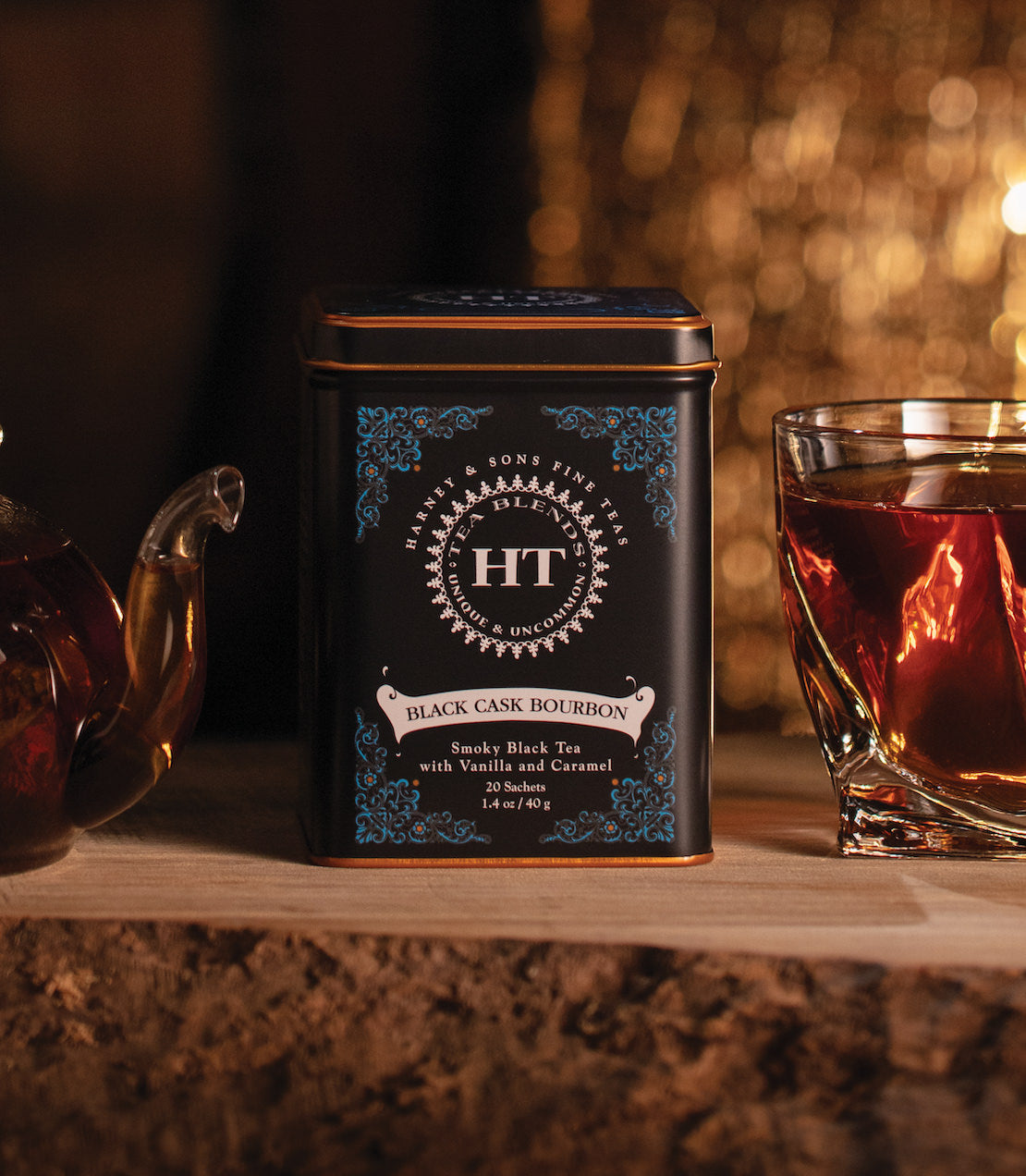 Black Cask Bourbon HT tin with 20 sachets, featuring sandy black tea with vanilla and caramel, displayed with a glass.