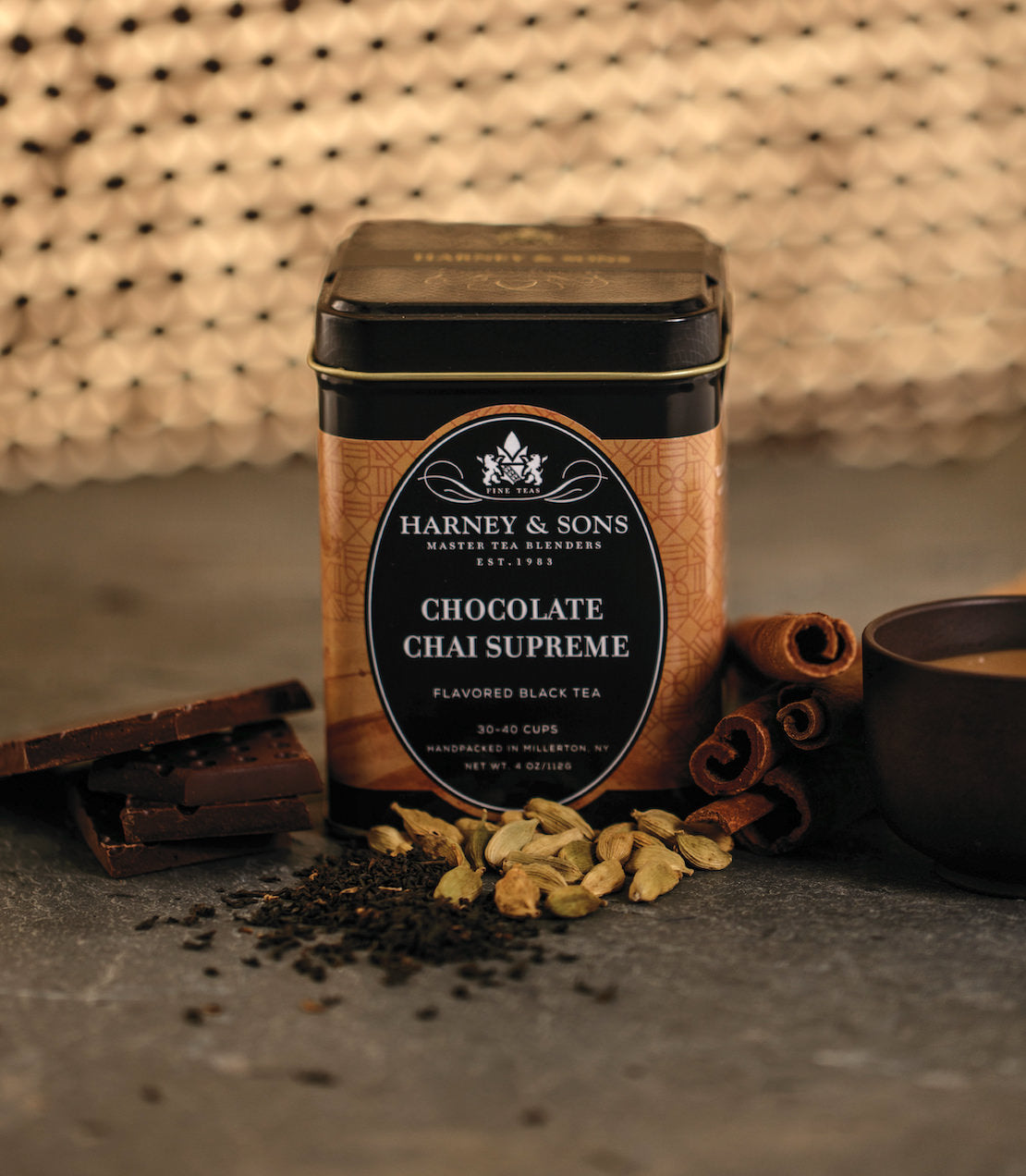 Harney & Sons Chocolate Chai Supreme tea tin with spices and a cup, showcasing flavored black tea blend.
