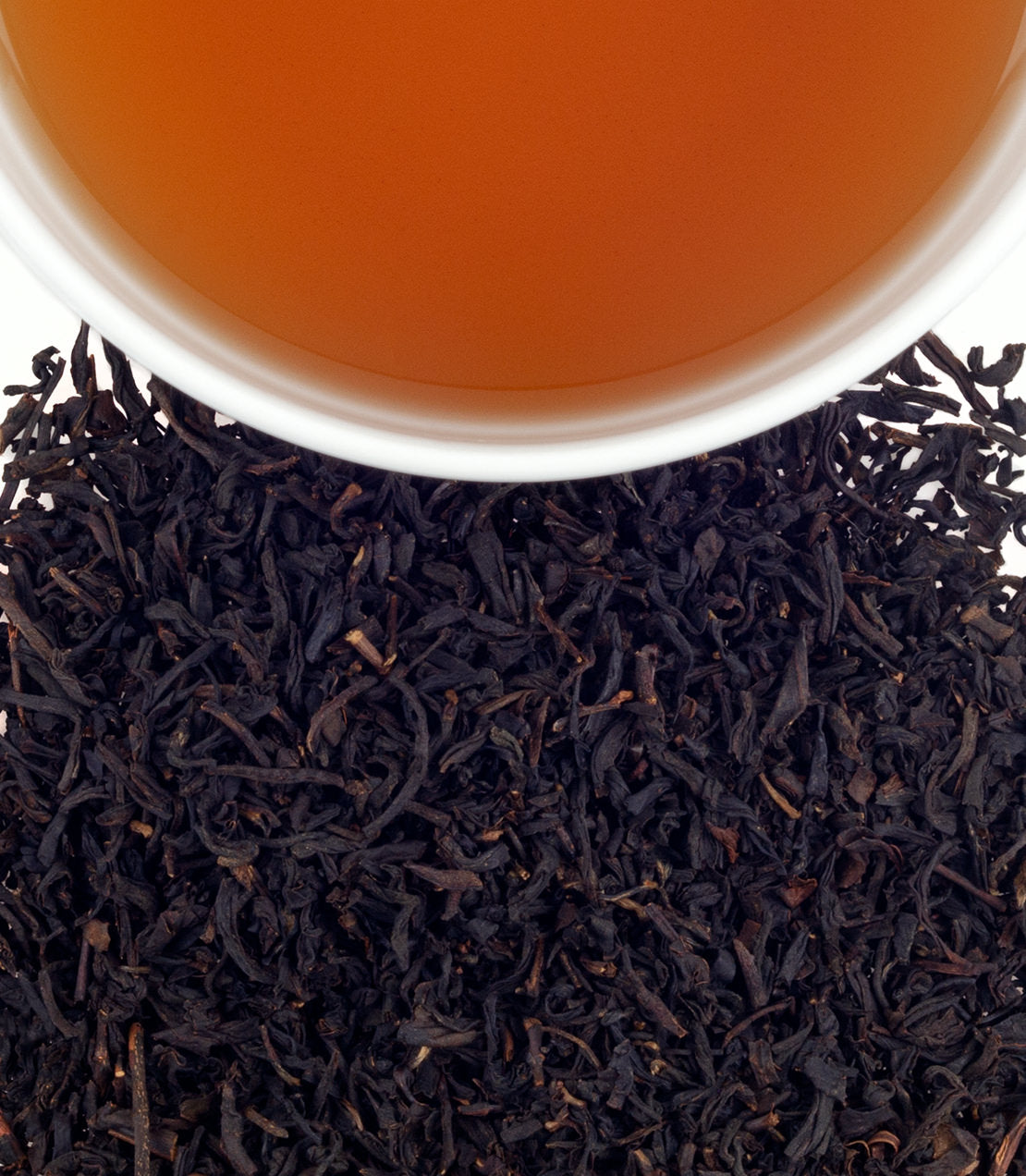Harney & Sons Fine Teas- Known & Loved cup shot- overhead shot of brewed tea and tea leaves
