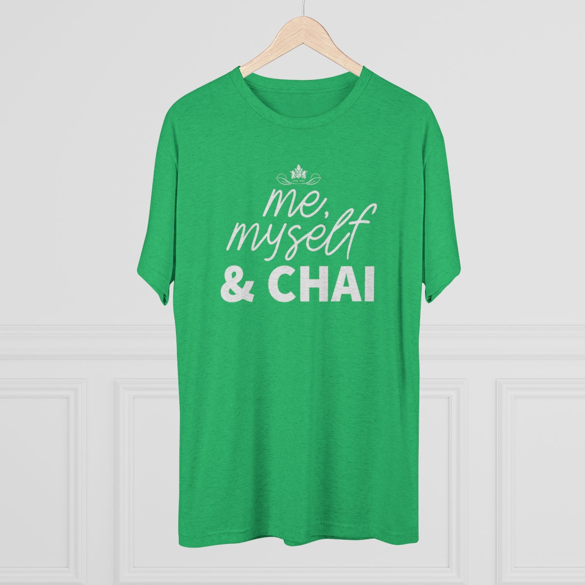 Green graphic tee featuring the text "me, myself & CHAI" in bold white letters, perfect for tea lovers.