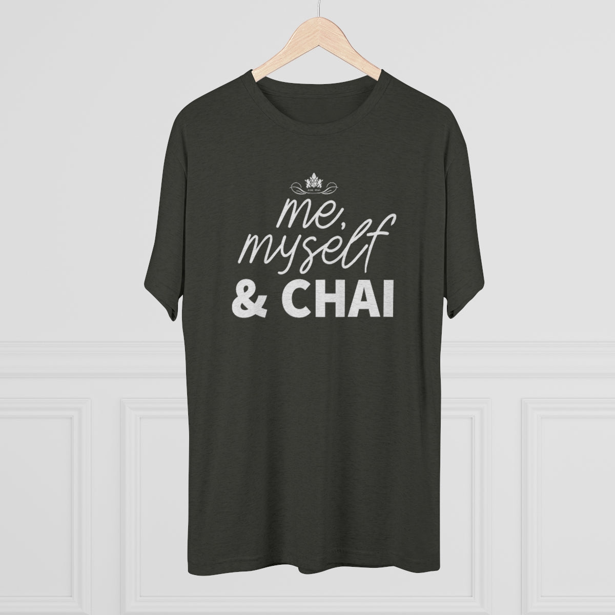 Dark green graphic tee featuring the text "me, myself & CHAI" in bold white letters. Perfect for chai lovers.