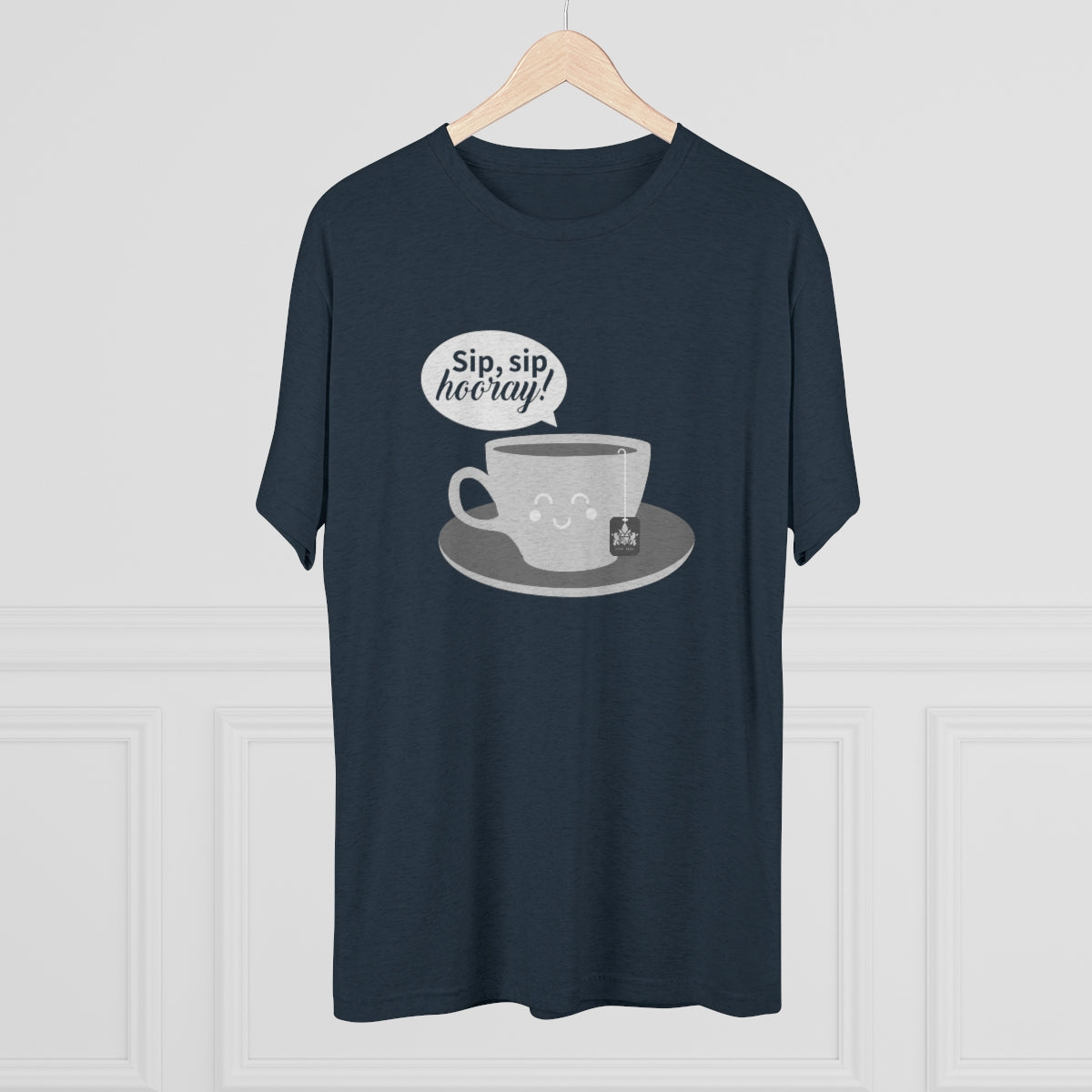 Dark graphic tee featuring a smiling coffee cup and the text "Sip, sip, hooray!" on a light background.
