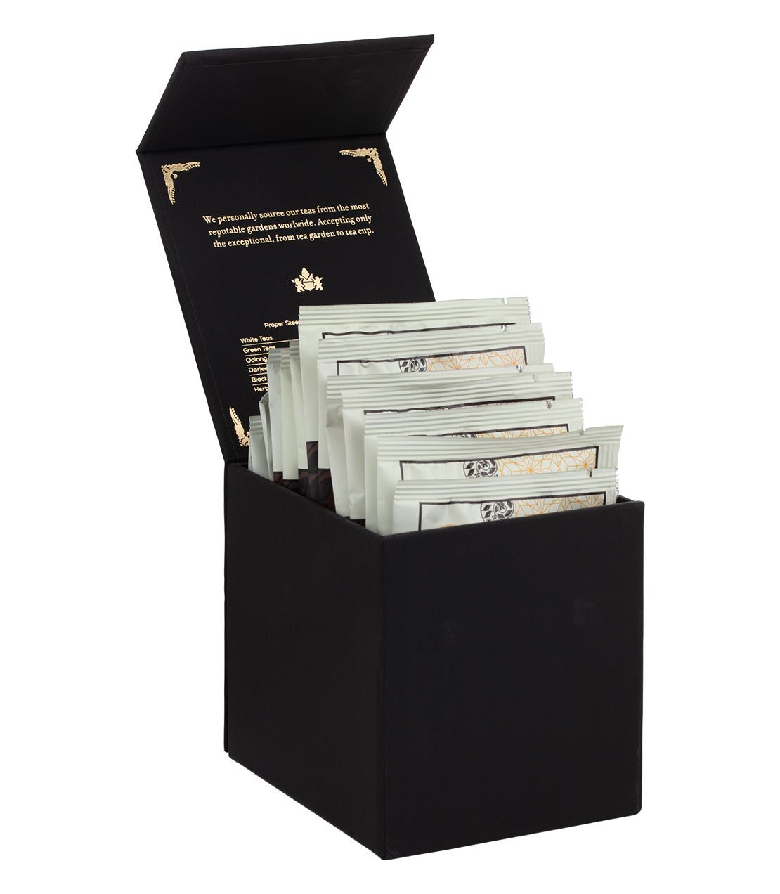 Harney Heritage herbal and decaf sachet sampler in a black box, featuring multiple wrapped tea sachets inside.