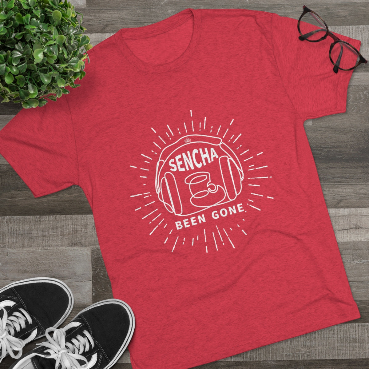 Red graphic tee featuring "Sencha Been Gone" text and a tea cup design, styled with casual shoes and glasses.