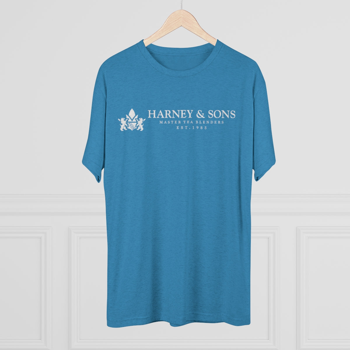 Blue graphic tee featuring "Harney & Sons Master Tea Blenders Est. 1983" printed on the front.