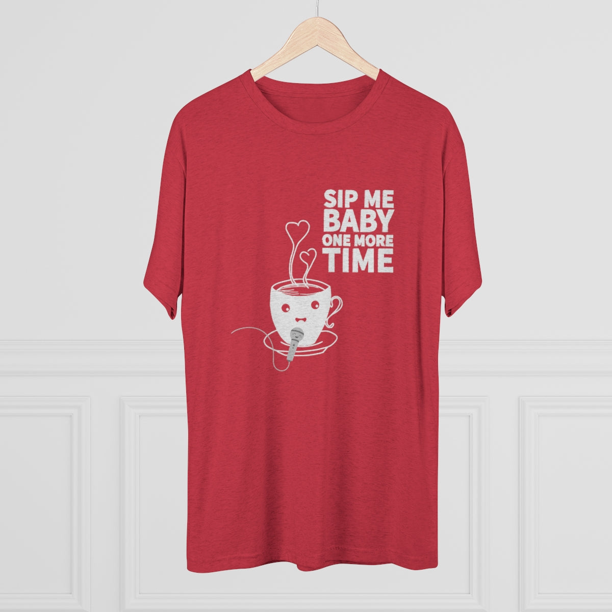 Red graphic tee featuring a playful coffee cup design with the text "Sip Me Baby One More Time." Perfect for coffee lovers.