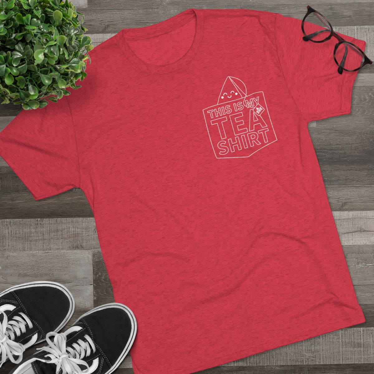 Red graphic tee featuring the text "This Is My TEA SHIRT" with a tea bag illustration. Perfect for tea lovers.