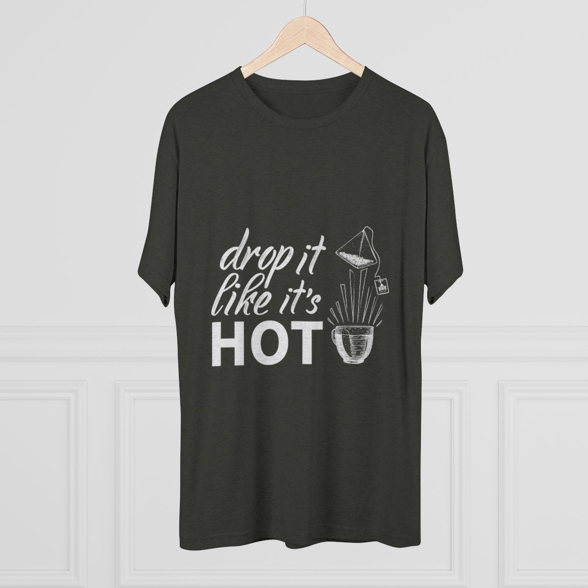 Dark green graphic tee featuring the phrase "drop it like it's HOT" with a playful design. Perfect for casual wear.