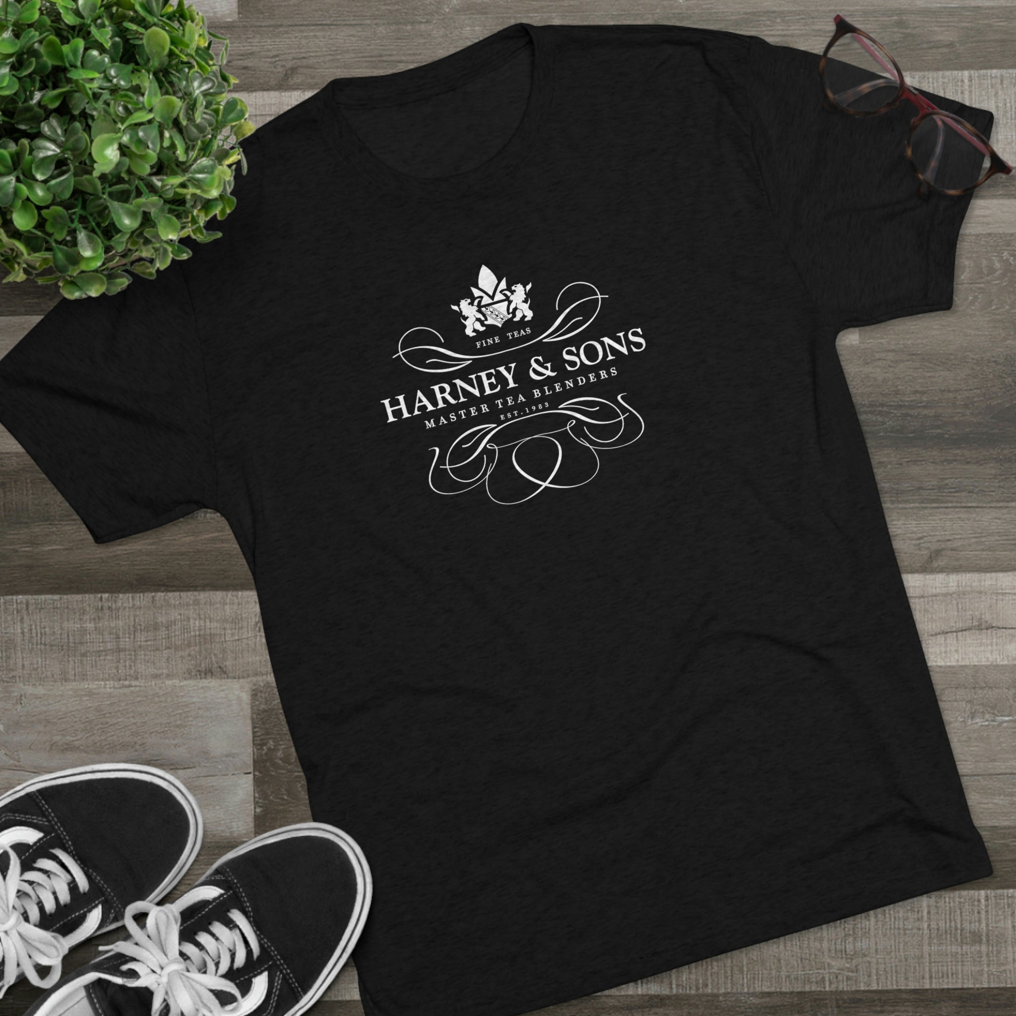 Black graphic tee featuring the Harney & Sons logo, showcasing elegant typography and design elements.