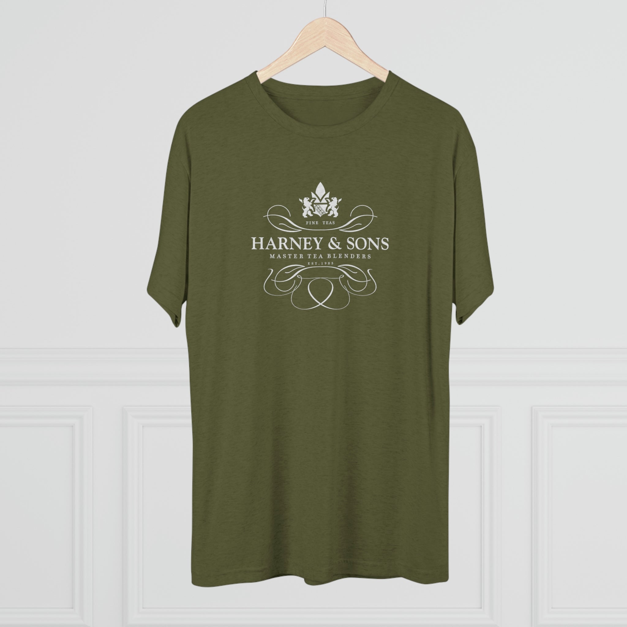 Olive green graphic tee featuring the Harney & Sons logo with elegant design elements. Perfect for tea lovers.