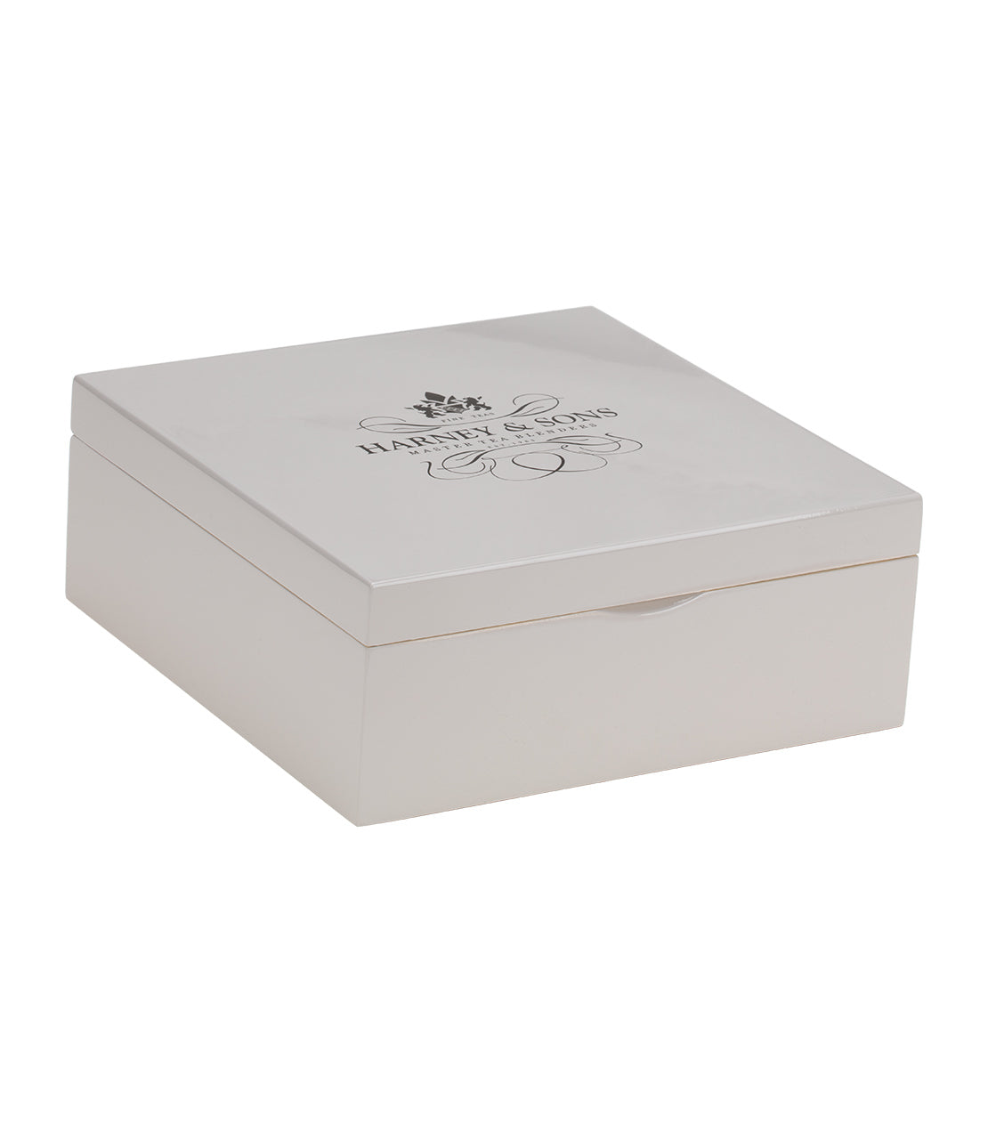 Taupe wooden heirloom tea chest with a sleek design, featuring nine assorted teabags inside.