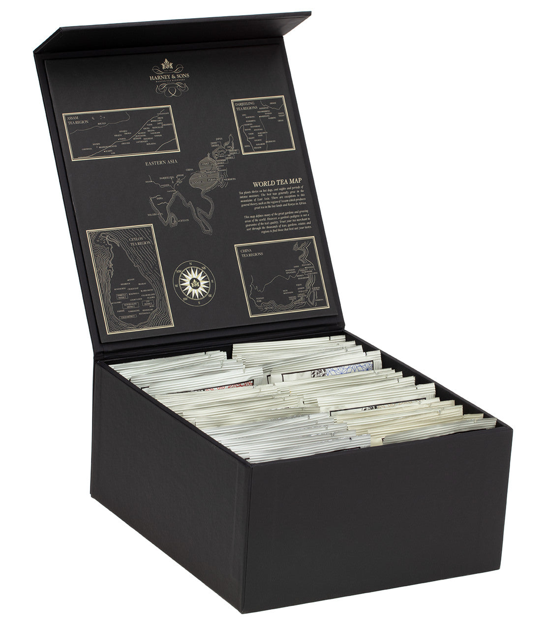 Harney Heritage Wrapped Sachet Tea Chest open, showcasing assorted tea sachets and a world tea map inside.