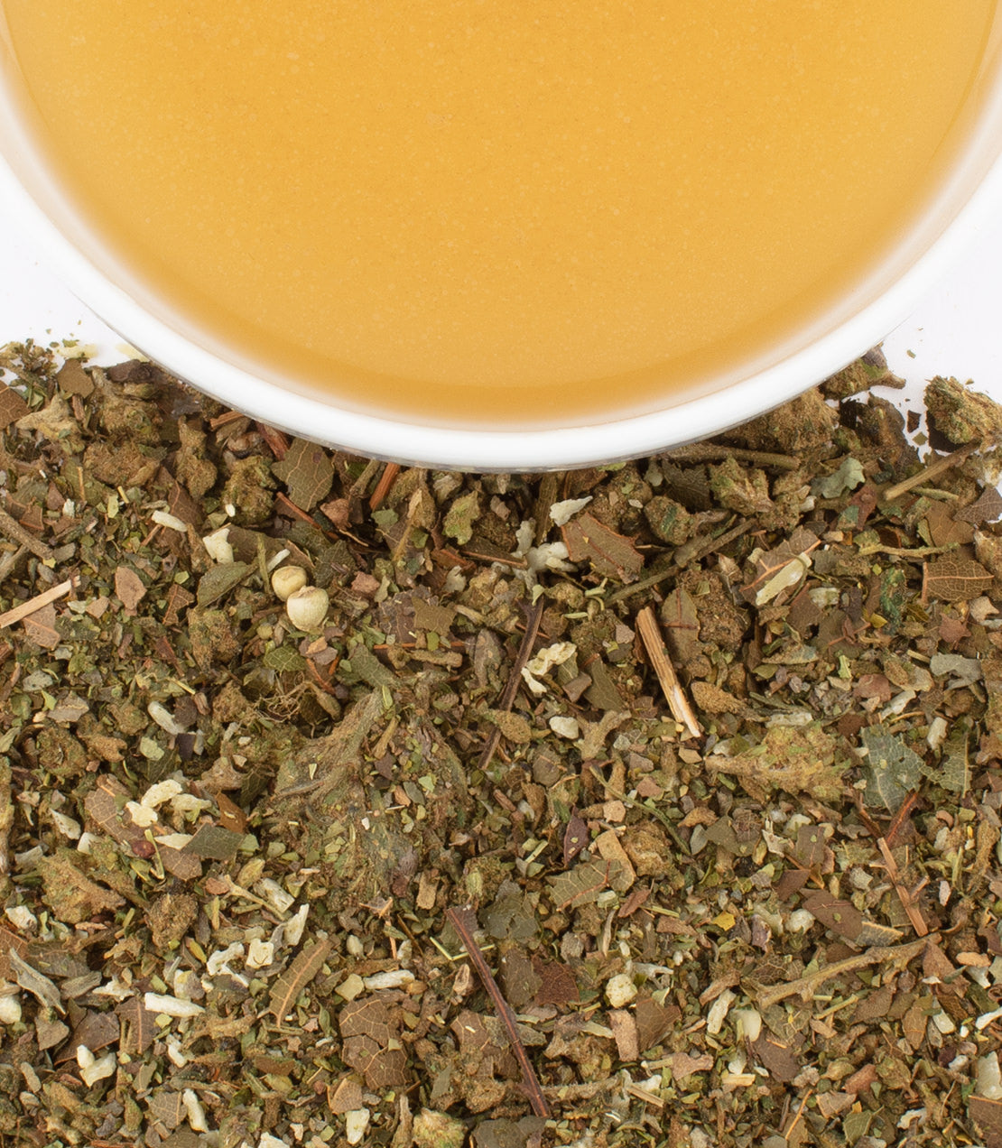 Hemp avocado blend featuring ground herbs and a bowl of golden oil, ideal for healthy recipes.