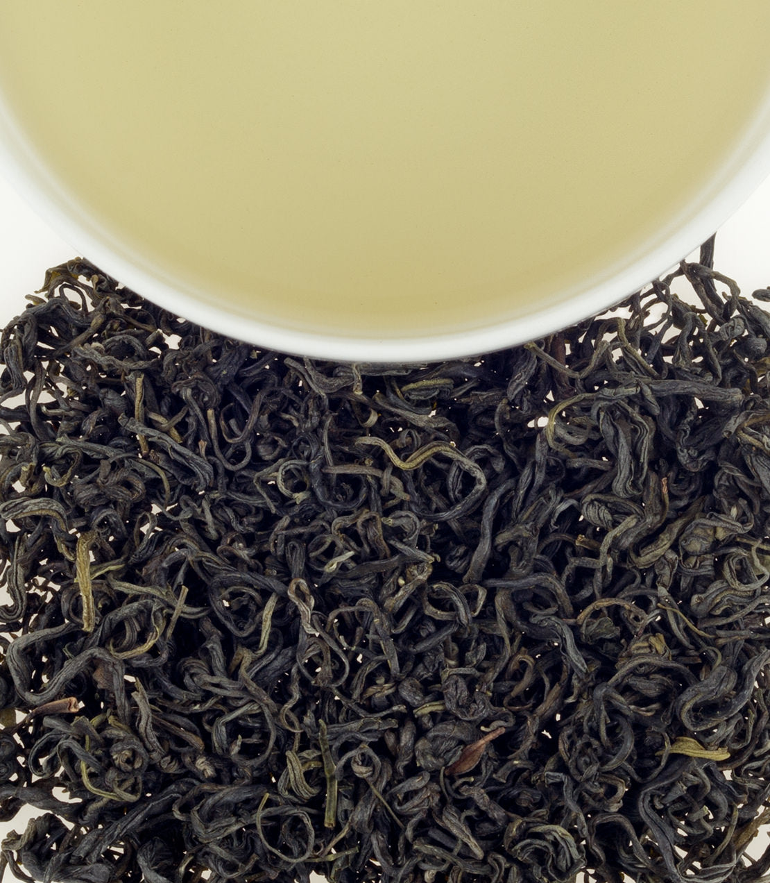 Hunan Mao Jian tea leaves with a cup of brewed tea, showcasing rich color and texture.