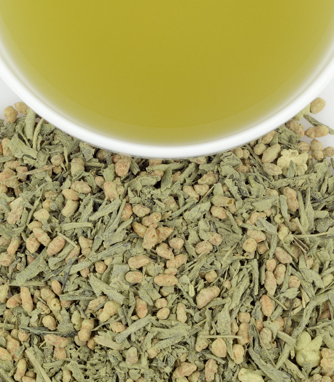 Matcha Iri Genmaicha tea sachets with brewed green tea and loose tea leaves, showcasing a vibrant green color.