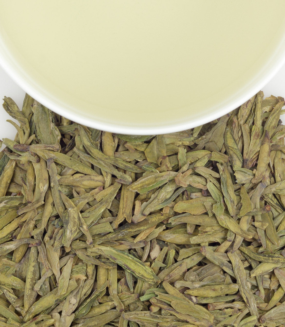 Meijiawu Lung Ching green tea leaves with a cup of brewed tea, showcasing vibrant green hues and delicate texture.