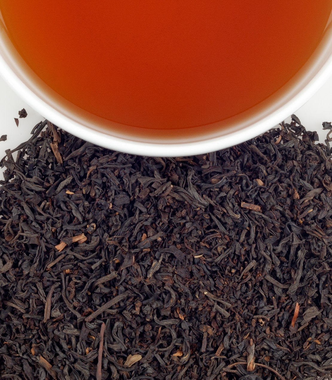 Bag of 50 Russian Country tea sachets with brewed tea in a cup, showcasing rich black tea leaves.