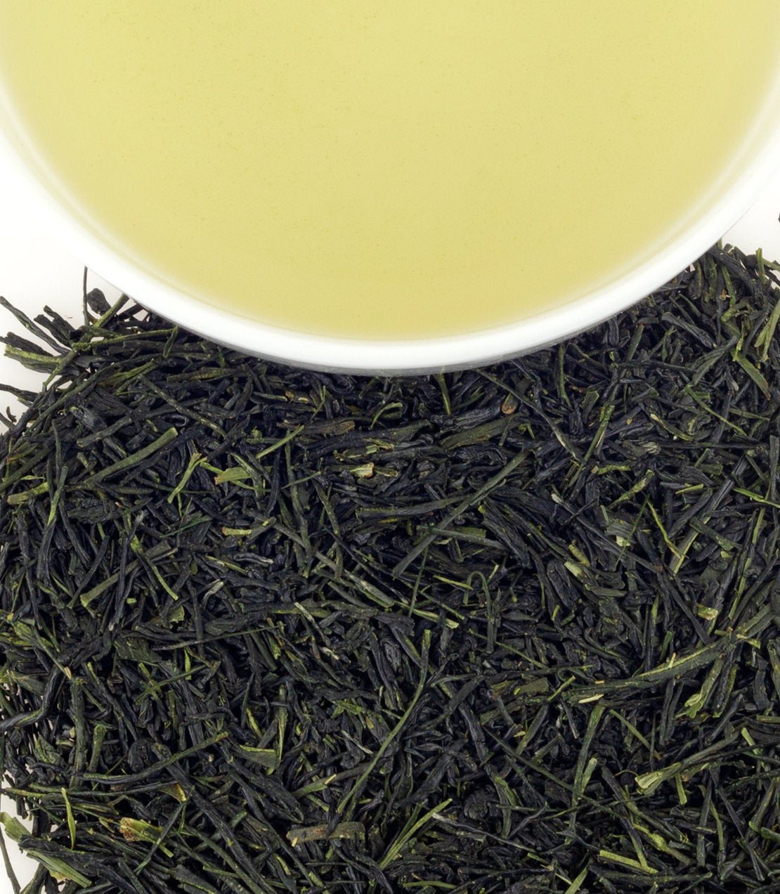 Kagoshima Yutaka Midori green tea leaves with a cup of brewed tea, showcasing vibrant color and rich texture.