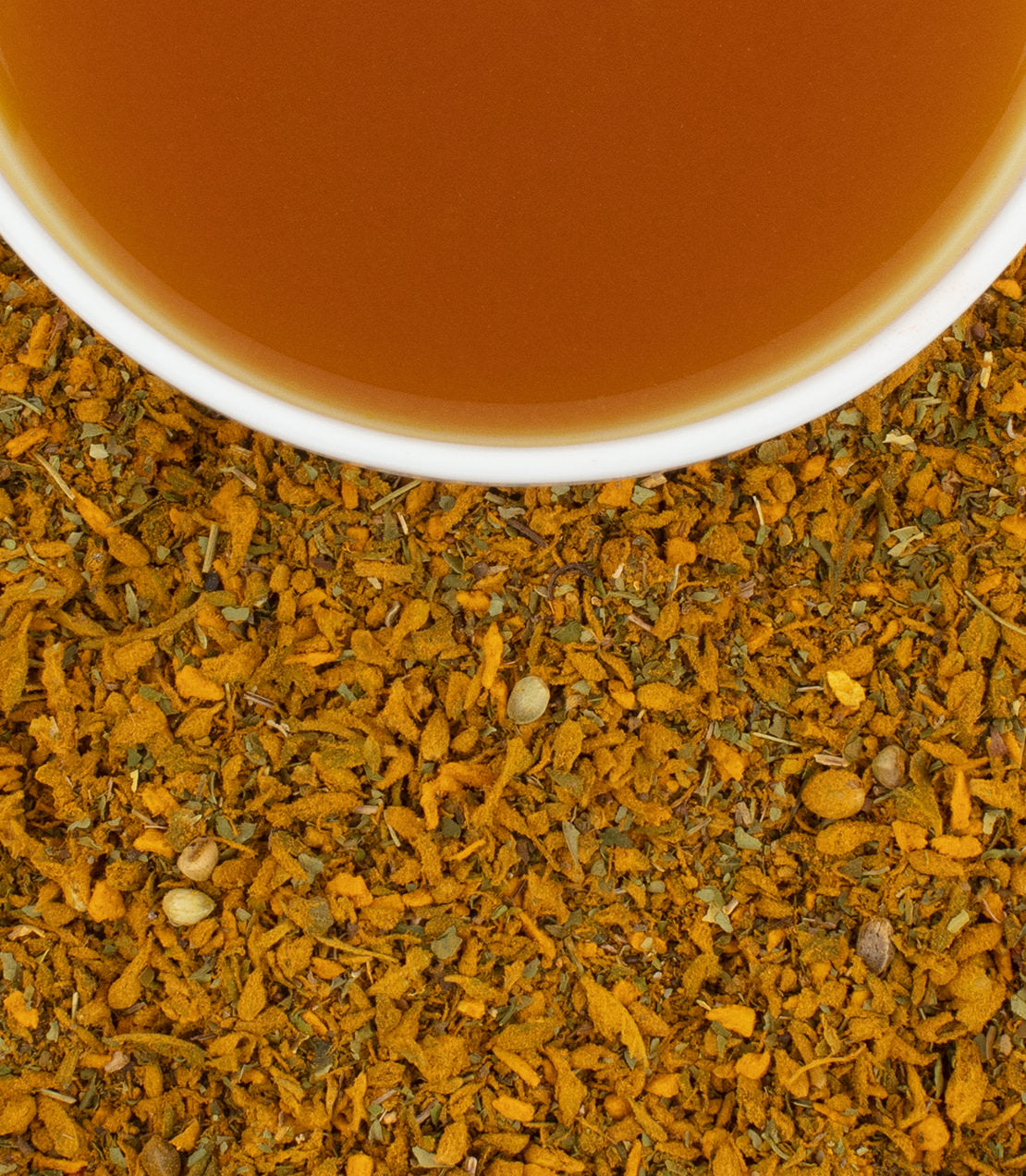 A cup of deep brown tea sits atop a bed of finely ground hemp and moringa blend, promoting restful sleep.