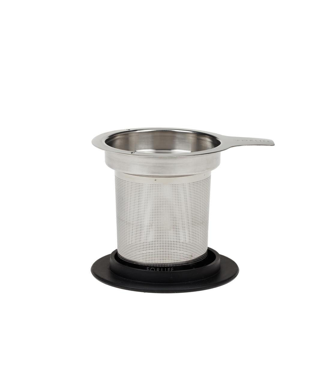 Extra-fine tea infuser with lid, stainless steel mesh, and black silicone base for brewing tea in a mug.