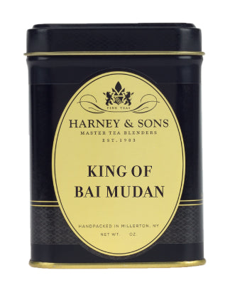 Black tin container of Harney & Sons King of Bai Mudan tea, featuring elegant gold label and logo.