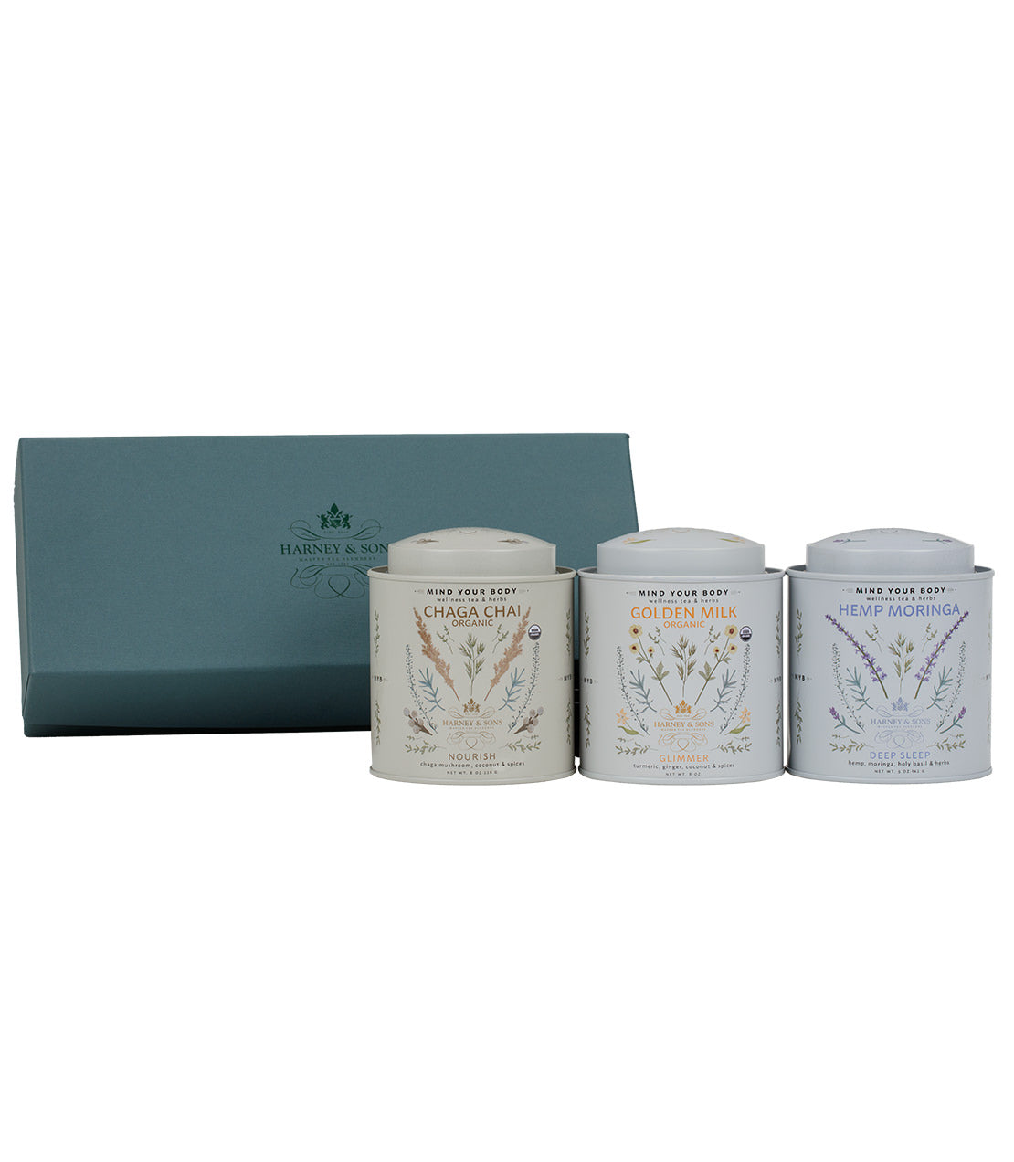 "Wellness Trio Gift set featuring Chaga Chai, Golden Milk, and Hemp Moringa in decorative tins.