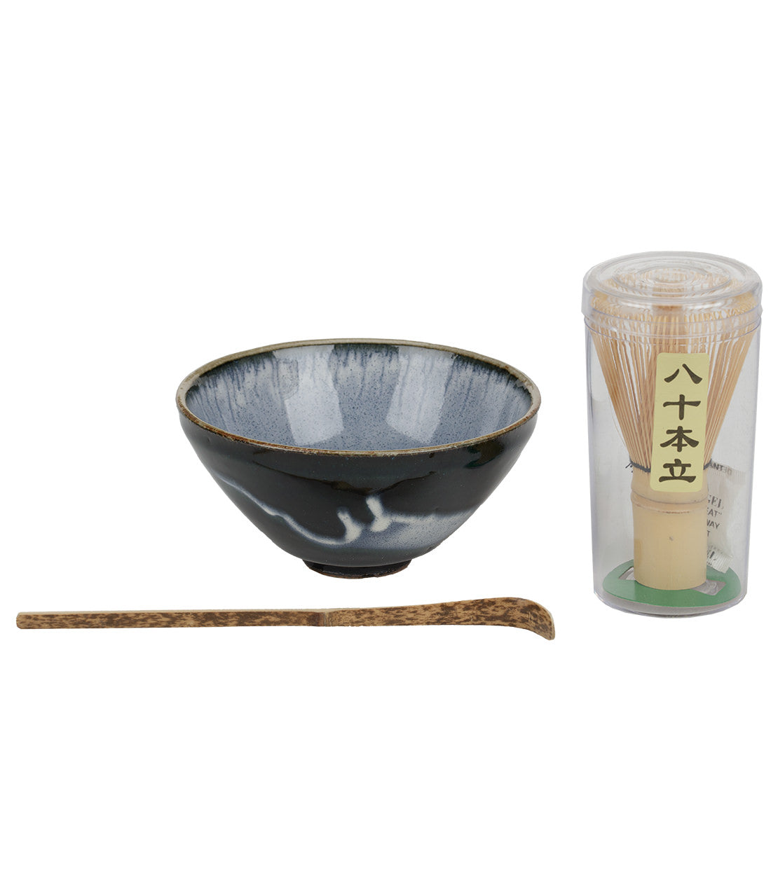 Assorted matcha set featuring a ceramic bowl, bamboo whisk, and scoop for preparing matcha tea.