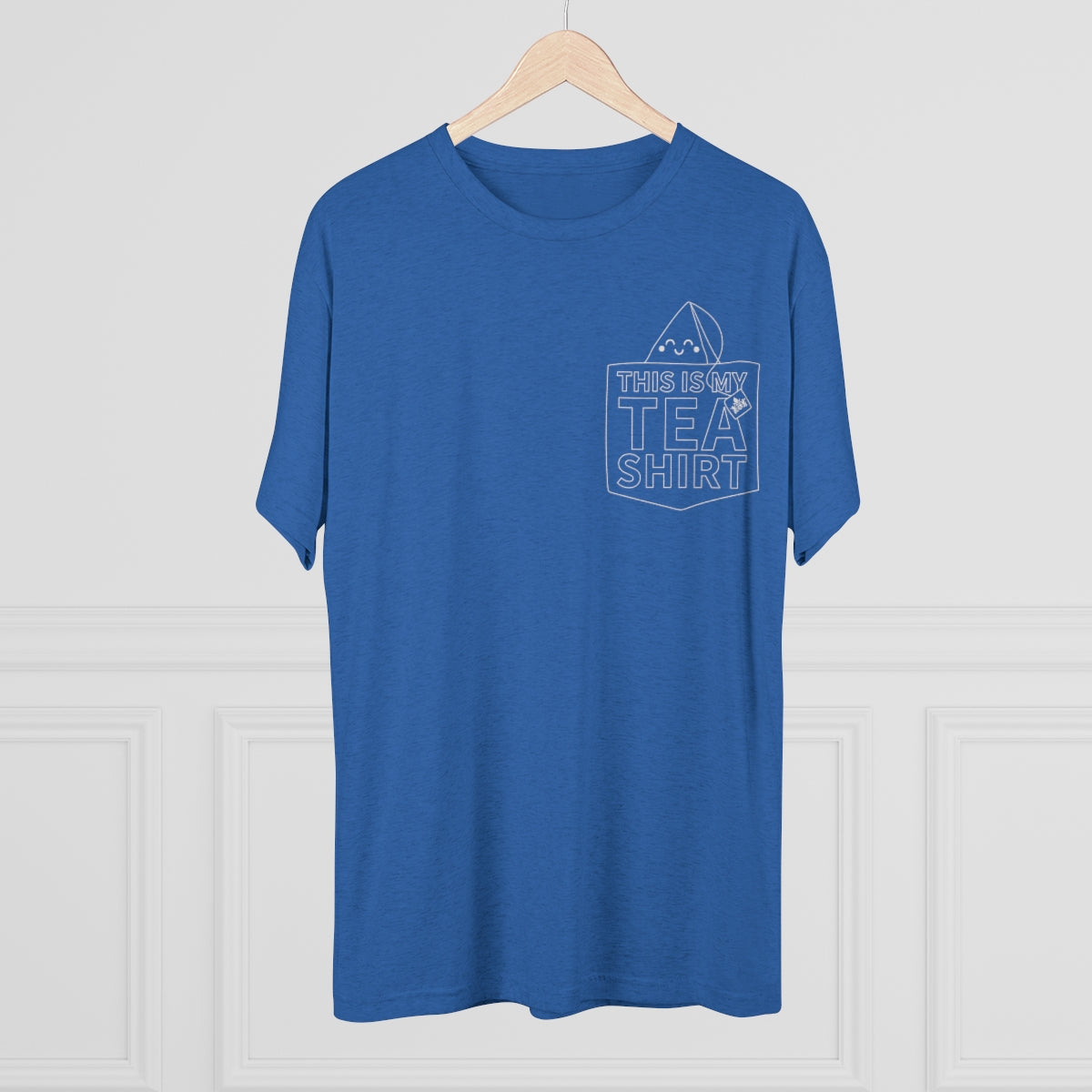 Blue graphic tee featuring the phrase "This Is My Tea Shirt" with a tea bag design on the pocket.