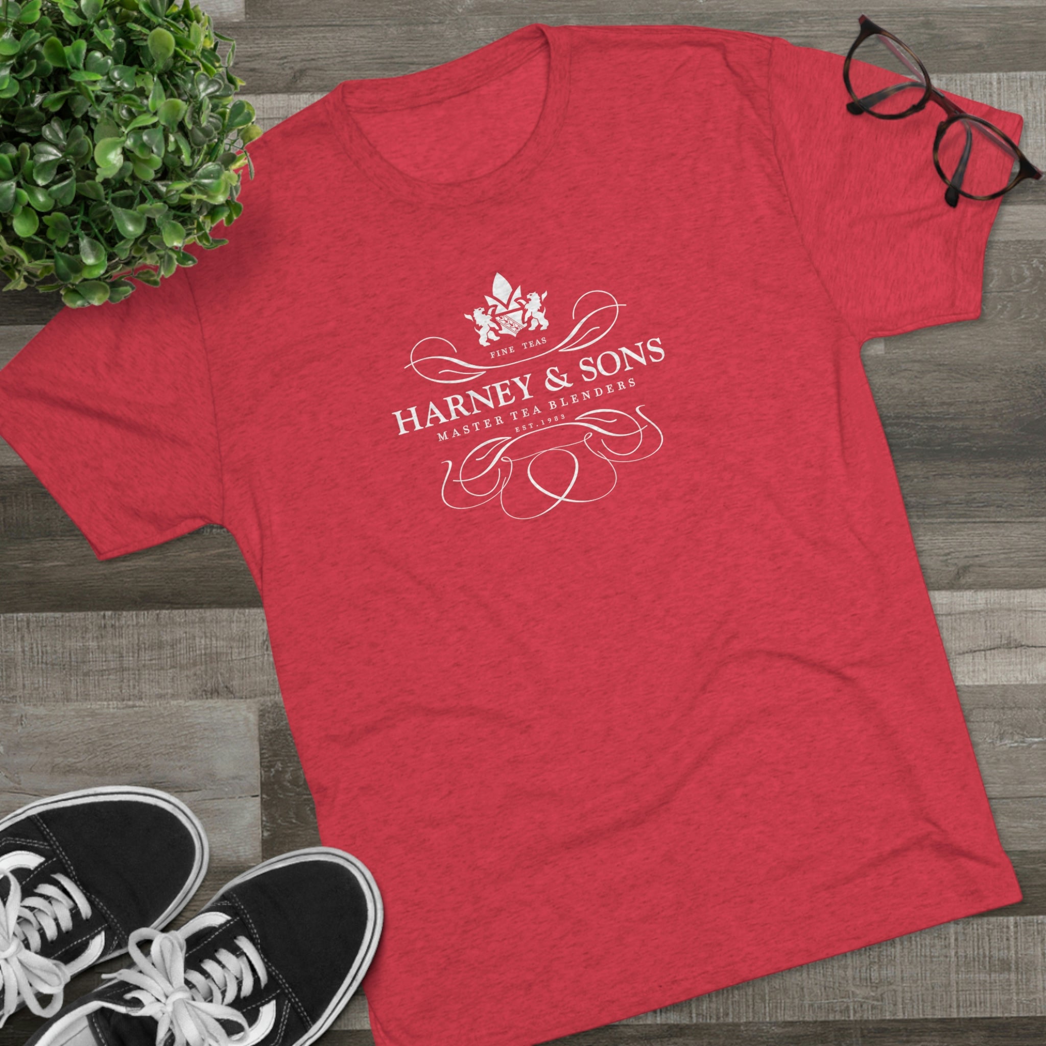 Red graphic tee featuring the Harney & Sons logo, showcasing elegant typography and a floral design.
