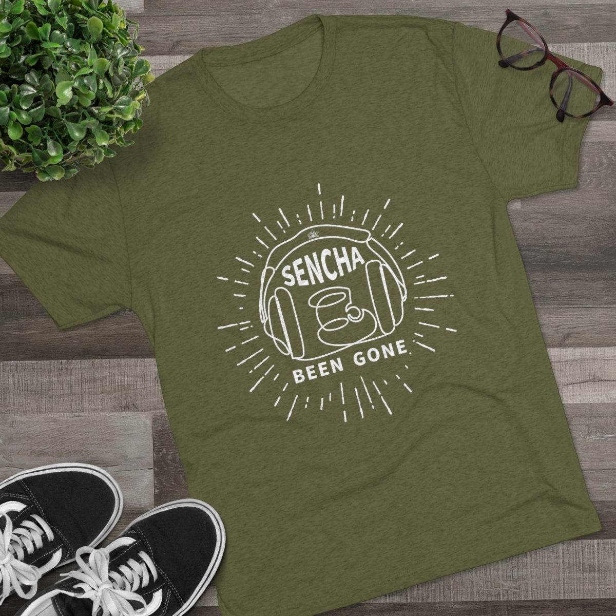 Olive green graphic tee featuring "Sencha Been Gone" design with a tea cup and sunburst elements.