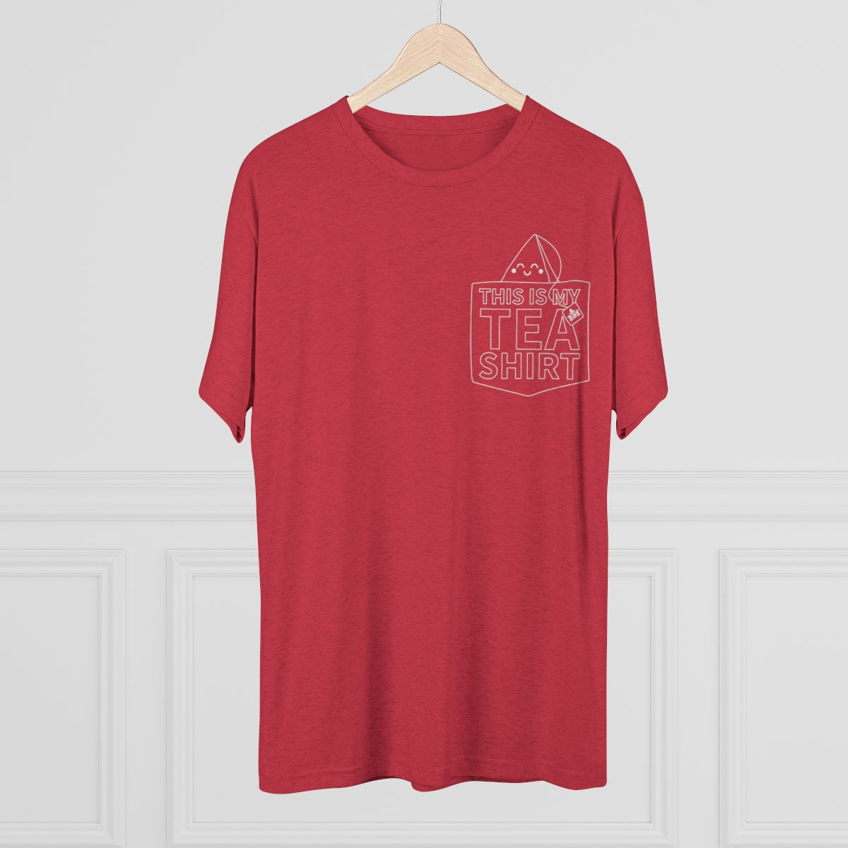 Red graphic tee featuring the phrase "This Is My Tea Shirt" with a playful tea bag design on the pocket.