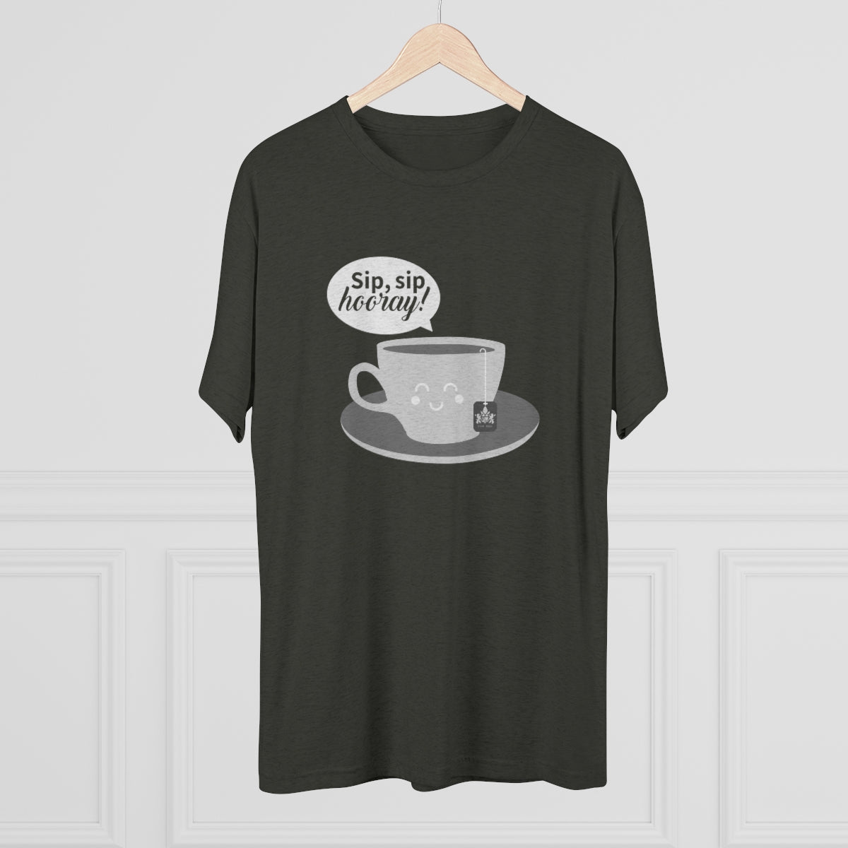 Dark green graphic tee featuring a smiling coffee cup and the text "Sip, sip hooray!" on a light background.
